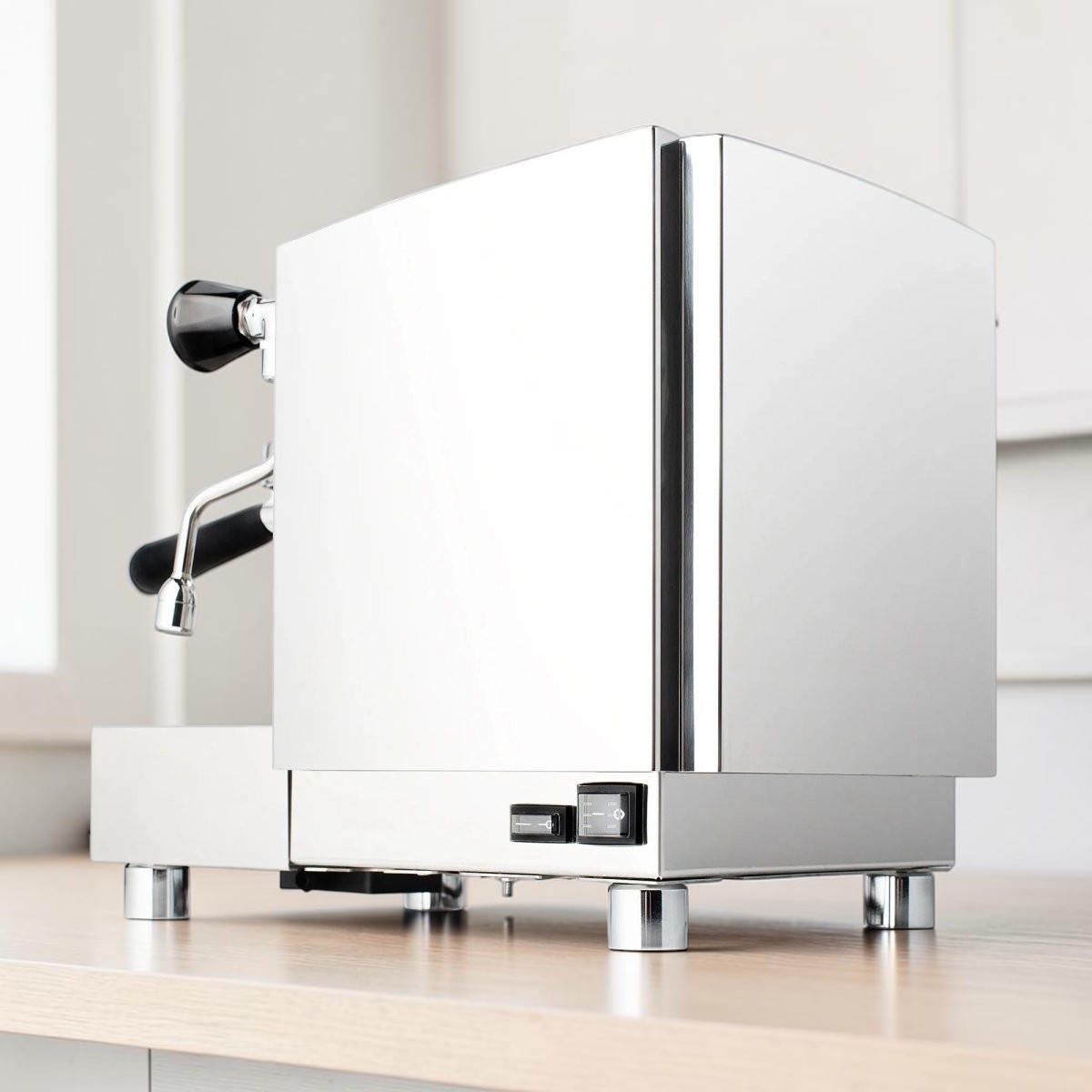 My Store Izzo Alex Duetto IV Plus dual-boiler espresso machine in polished stainless steel, side view.