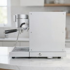 My Store WPM Primus coffee machine in silver with a 58mm portafilter, side view on a kitchen countertop.