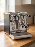Izzo Vivi Flat Coffee Machine on a wooden kitchen worktop