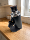 Turin DF64 Single Dose Grinder on a wooden kitchen worktop